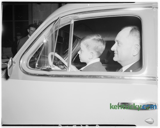 Adolph Rupp, University of Kentucky basketball coach and Herky, his son. Rupp was presented with a new car by members of Junior Chamber of Commerce at a dinner in his honor Sept. 23, 1946 at the Lafayette Hotel.