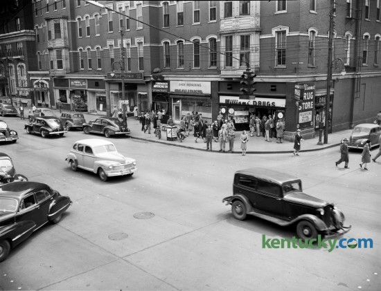 Southeast corner of Limestone and Main streets in 1947.  This corner is currently occupied by Phoenix Park. The photo was taken to run with a story about increased congestion that was expected as a result of an ordinance passed by the Board of City Commissioners that would allow the Lexington Railway System to erect a change-making and information booth there. Published in the Lexington  Leader, May 8 1947.