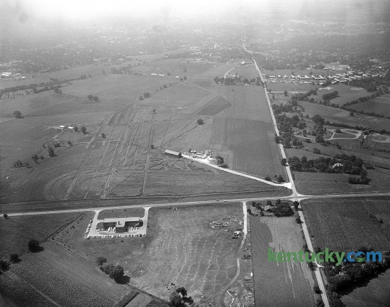 Grading had begun in August of 1956 for International Business Machine Corporation's new factory at the intersection of New Circle Rd. (running from left to right across the picture) and Newtown Pike. The 386,000-square foot typewriter plant employed 1,800 people when it opened. By 1985 IBM had 6,000 workers, second only to the University of Kentucky's 7,500. 