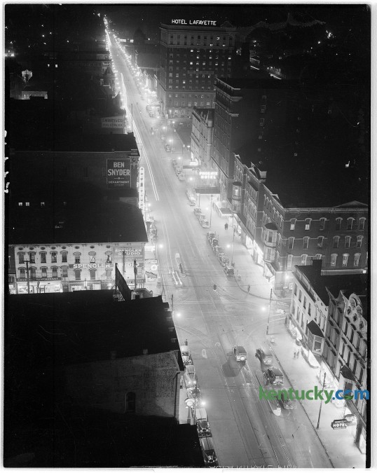 View of Main St. downtown Lexington at night time, 1944. Picture taken looking towards the east. At top is the Lafayette Hotel, which is now the offices of the Fayette Urban Lafayette Hotel Government.