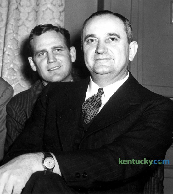 University of Kentucky football coach Paul (Bear) Bryant, left, and men's basketball coach Adolph Rupp. Members of the Kentucky General Assembly and UK coaches were honored March 7, 1946 at a  dinner at the Lafayette hotel given by Lexington attorney and former state senator Rodman W. Keenon. Keenon urged the state legislature to assist  the new athletic program at UK. 