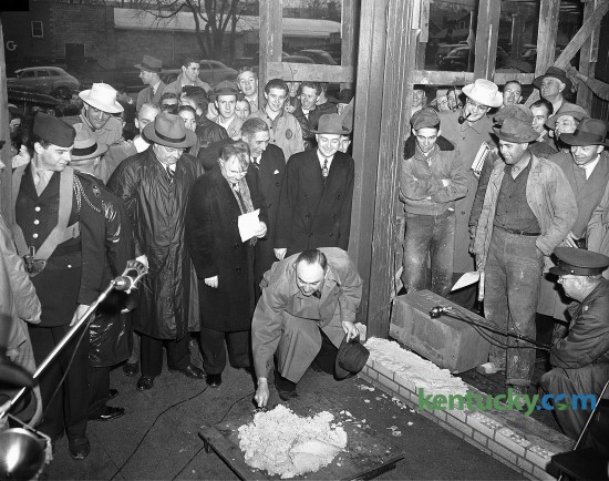 University of Kentucky basketball coach Adolph Rupp mixes mortar during a cornerstone-laying ceremony Feb 21, 1949 at the construction site of Memorial Coliseum. Completed in 1950, Memorial Coliseum not only served as home-court for the Wildcats, it's also a memorial to the more than 10,000 Kentuckians killed in World War I and the Korean Conflict. The UK men's basketball team played in Memorial from 1950 to 1976, compiling a record of 306-38 (.890).
