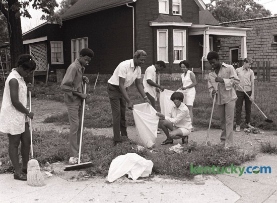 City Commissioner Harry Sykes, center, joined  officials of Micro-City Government in a neighborhood cleanup on  East Third Street on July 14 1971. Others in photo are from left  Sandra Young, Vincent Caise, Sykes, Pat Tribble and James  Clayborne. At rear from left are James Johnson and Linda Parr. 