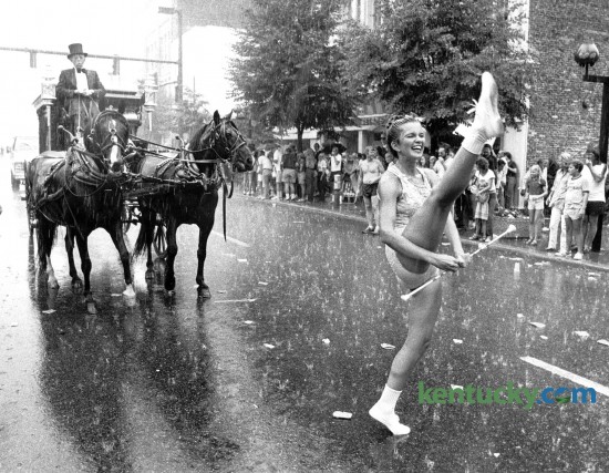 The July 4th parade in downtown Lexington was a wet one in 1981. Photo by David Perry, Herald-Leader staff