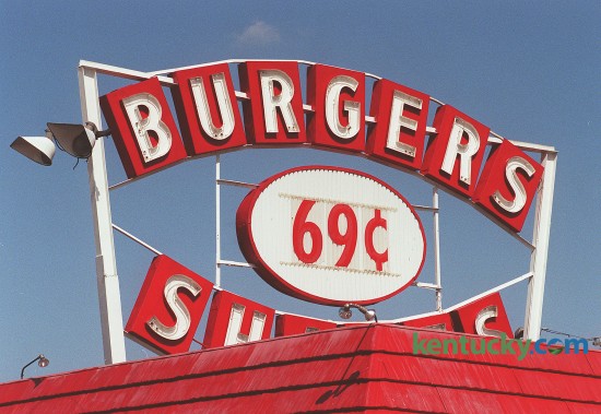 Sign for the Burger Shakes restaurant on New Circle Road, March 25, 1999. In 1957, Burger Shakes opened on the Northern Beltline, now known as New Circle Road. back then burgers and shakes were 19 cents, fries cost 14 cents, and Cokes were a dime. Today the sign says 99 cents. 