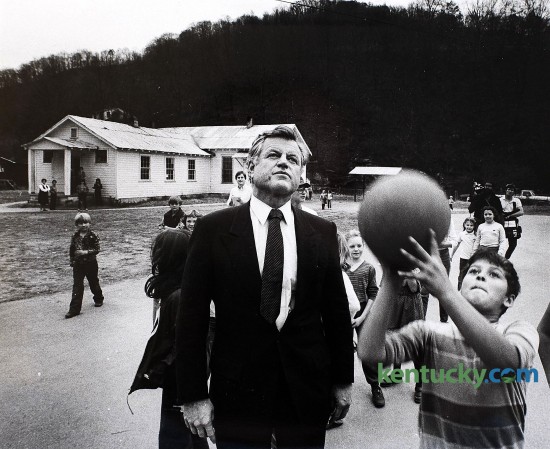 U.S. Senator Edward Ted Kennedy watched school children shoot basketball at the Spruce Pine Elementary School in Honaker, Ky., as part of his nationwide survey of hunger in America tour, on Nov. 23, 1983. Kennedy, who was a seven-term Democratic senator form Massachusetts, visited Floyd and Letcher counties. Kennedy was the fourth-longest-serving senator in U.S. history when he died in 2009. Photo by Charles Bertram, Herald-Leader staff
