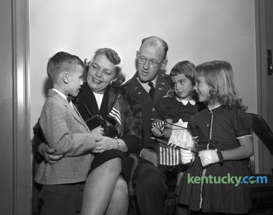 Major and Mrs. R. D. Hobdy shown with their three adopted German-American children who became naturalized citizens of the United States on January 19, 1961. The children from left are Robert, 5, Leta, 3, and Karla, 4. All three were adopted in Germany while Maj. Hobdy was there on duty. Published in the Lexington Herald January 20, 1961. 