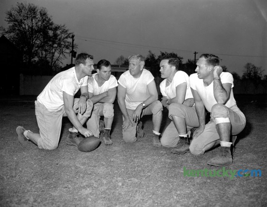 University of Kentucky football coaching staff in the spring of 1946, "Bear" Bryant's first season at UK. Pictured from left  are head coach Paul "Bear"  Bryant, Frank Moseley and Carney Laslie, all products of Alabama football, Mike Balitsaris, former Tennessee end, and Joe Atkinson, former captain and guard at Vanderbilt. The caption published in the Leader on April 16, 1946 said  "this is the first photograph of the complete lineup of the Wildcat's new pigskin professors." 