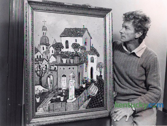 Eccentric Lexington artist and poet Henry Faulkner with one of his paintings, March 30, 1977. Faulkner, a close friend of Tennesee Williams was born in eastern Kentucky in 1924.  He moved to Lexington in 1956 and became well know for both his critically acclaimed paintings and his flamboyant lifestyle. Faulkner died in 1981. Photo by John C. Wyatt | Staff