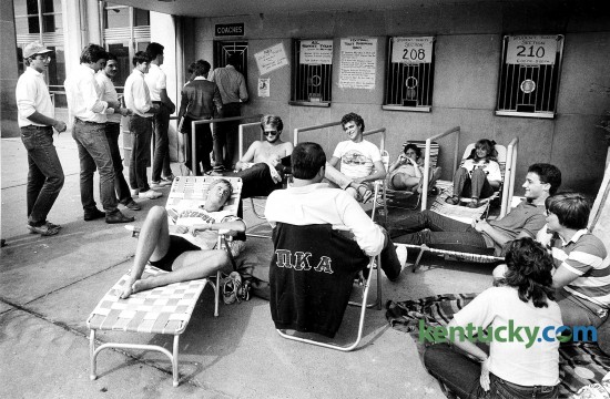 A group of UK students waited outside the ticket office at Memorial Coliseum on Sept. 4, 1984, for the “good” seats to become available for UK football’s 1984 season opener at Commonwealth Stadium. The group had been waiting since 8:30 a.m. for the release of tickets at 6 p.m. for sections 208 and 210. The line on the left was for the rest of the seats. Photo by Charles Bertram | Herald-Leader Stafff