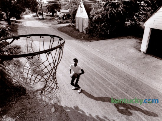 In 1985 the Herald-Leader did feature stories on various Fayette County communities, including Bracktown. Michael Wilson, born in Bracktown,  played basketball in the street. The goal was nailed to an old tree beside the road. Bracktown is a community located in western Fayette County on Leestown Road. It was established about 1887 when land owned by Robert Stone, the Martin family, and the Reverend Frederick Braxton was subdivided and sold to freed slaves. Photo by Charles Bertram | Staff