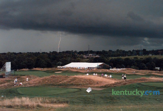 Severe thunderstorms halted play August 8, 1996 at the 78th PGA Championship at Valhalla Golf Club in Louisville. Thunderstorms scattered thousands of fans and interrupted play for almost four hours. But the weather didn't bother Kentucky native Kenny Perry, who took the first-round lead after sinking a 20-foot putt in the fading light as play was ended at about 8:30pm with 60 players still on the course. Photo by Michelle Patterson | Staff