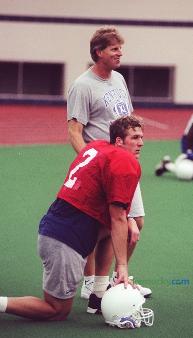 First-year University of Kentucky football coach, Hal Mumme stands over sophmore quarterback Tim Couch durning pratice Tuesday, Aug. 20, 1997 at the  Nutter Field House in Lexington. Mumme was announced as UK coach Dec. 2, 1996 and by Christmas he named the Kentucky native his starting QB. Couch had finished his freshman season under Bill Curry in a QB controversy with Billy Jack Haskins. Photo by Frank Anderson | Herald-Leader staff