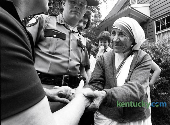 Mother Teresa shook the hands of a well wisher upon her arrival in small eastern Kentucky town of Jenkins on June 19, 1982. She was there to open her first Appalachian mission established by her order, The Missionaries of Charity.  Photo by Charles Bertram | Staff