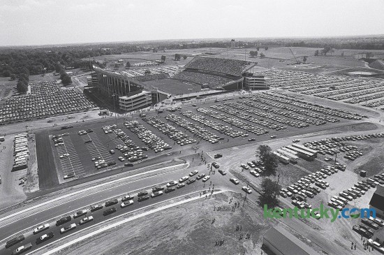 Traffic outside Commonwealth Stadium on Sept. 15, 1973, prior to the first game played at the new home of the Wildcats. After playing 48 years at Stoll Field, the Cats won their first game at Commonwealth, 31-24 over Virginia Tech. The stadium and parking rest on what was once part of the UK Experimental Station Farm Grounds. Commonwealth Stadium had a capacity of 57,800 cost $12 million to build - a tenth of the cost for the current renovation.