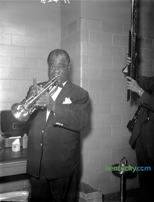 Trumpeter Louis "Satchmo" Armstrong warmed up backstage before an appearance for Greek Week at the University of Kentucky in 1960. Published in the Lexington Herald February 20, 1960. 