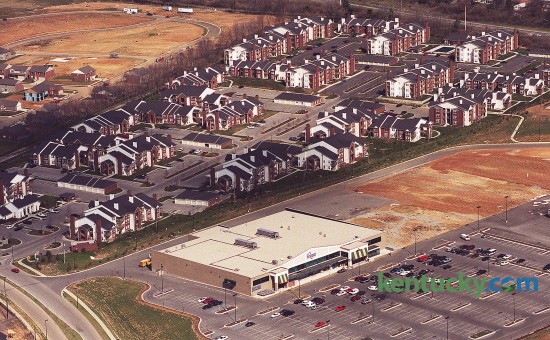 Aerial photo looking at the new Kroger and apartments in the Beaumont Farm development on Harrodsburg Rd. at New Circle Road in Lexington, March 6, 2000. The 63,000-square-foot Kroger anchored the new shopping center, which covered a total of 250,000 square feet on more than 30 acres of land. Neighbors in the Harrods Hill subdivision originally objected to the plan, which had called for an unnamed 123,000-square-foot store next to Kroger. After meeting with neighbors, the size of the store was reduced to 50,000 square feet. Years later the Kroger expanded to what it is now, a 125,000-square-foot MarketPlace store. Photo by Charles Bertram | staff