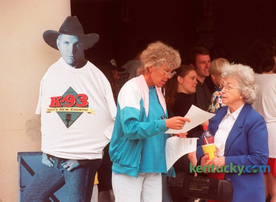 Della Mitchell of Richmond, left, talks with her mother, Helen Rogers of  Lexington, right, about the rules for the wristbands they received in the lottery for Garth Brooks concert tickets at Rupp Arena on Wednesday, April 15, 1998. Brooks first of three Lexington shows was Friday May 15. Photo by Michelle Patterson | Staff