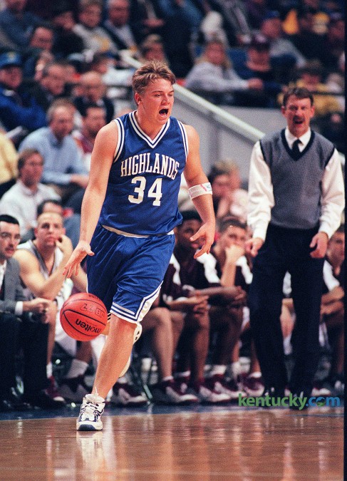 Highlands guard Jared Lorenzen yells a play during an opening round game in the Boys' Sweet Sixteen March 11, 1999 in Rupp Arena. Henderson Co. rallied to stun Highlands, 62-60, ending Lorenzen's high school basketball career. He later went on to play quarterback for the University of Kentucky football team. Lorenzen, along with fellow star and UK-football signee Derek Smith, led Highlands to an undefeated season and a second Class 3A football title in three years during the fall of his senior year in high school. In basketball, the Bluebirds made their third consecutive appearance in the Sweet Sixteen. Lorenzen, who was listed as a 6-4, 240-pound forward, contributed 14 points, 8.6 rebounds and five assists a game that year. Photo by Charles Bertram | staff