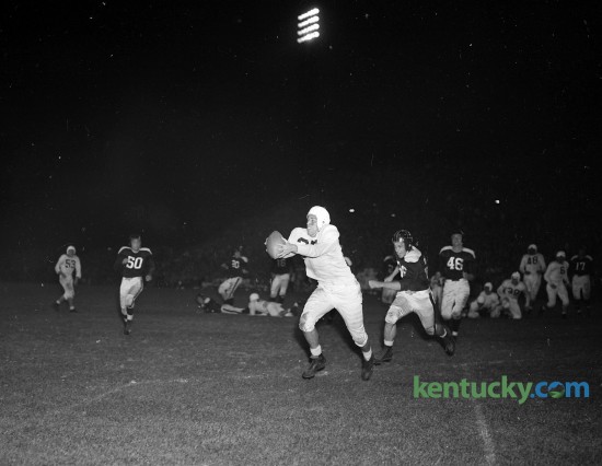 Wallace "Wah-Wah" Jones caught Bill Boller's 11-yard pass for a touchdown during Kentucky football's 70-0 win over Xavier Oct. 5, 1946 at Stoll Field. Wallace “Wah Wah” Jones, widely considered the greatest all-around athlete in UK history, played both football and basketball for the Cats. As such, he held the distinction of playing for two lionized coaches: Adolph Rupp in basketball and Paul “Bear” Bryant in football. On the gridiron Jones was was an all-Southeastern Conference player and on the hardwood he was a member of the Fabulous Five, the basketball team that in 1948 won the first of UK’s eight national championships.