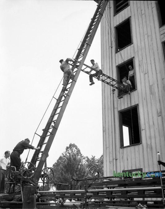 Lexington firemen demonstrated an aerial bridge during training at a fire school in 1948. Published in the Lexington Leader June 10, 1948.