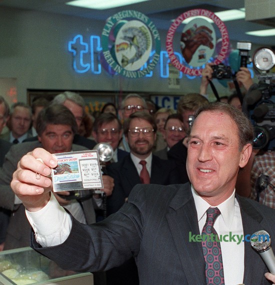Kentucky Gov. Wallace Wilkinson bought the first offical lottery ticket at a Thorntons gas station and food mart in Louisville April 4, 1989. Wilkinson, who made the creation of a lottery the cornerstone of his 1987 gubernatorial race, bought $3 worth of tickets and came up empty. Wilkinson turned and jokingly told lottery President Frank Keener that he "could have organized this a little better." The governor later bought $100 worth of tickets -- 50 "Beginner's Luck" and 25 "DreamStakes" -- for his wife, Martha. Kentucky voters overwhelmingly supported the lottery in last fall's general election. The Kentucky Lottery Corporation says it has earned nearly $4 billion for Kentucky's state treasury since 1989. Photo by Frank Anderson | staff