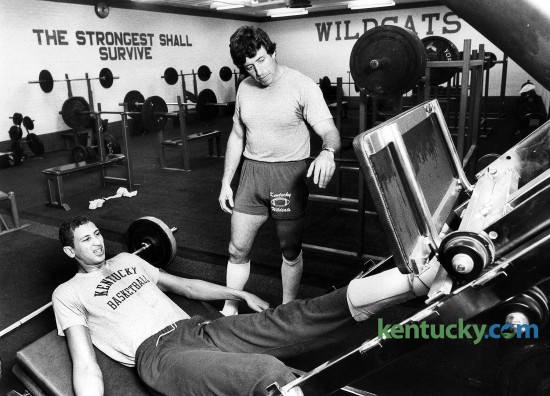 University of Kentucky  basketball player Sam Bowie worked with UK strength coach Pat Etcheberry on rehabbing his left leg in the weight room on the UK campus in Lexington, Ky., in 1981. Bowie, who was listed at 7'-1", sat out two seasons, 1981-82 and 1982-83 due to stress fractures. Bowie returned for the 1983-84 season, where he averaged 10.5 points while being named to the second-team All-American squad. Photo by Charles Bertram | Staff