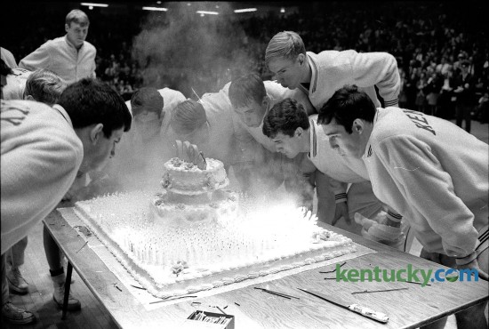 After defeating Tennesse on the road, the Kentucky basketball players came home to Memoral Colesium in Jan. 1969 to blow out 1,000 candles on a large cake celebrating the program's 1,000th win. The Cats will go for win number 2,141 Friday against Grand Canyon. In 112 seasons, UK has lost only 672 games. Photo by E. Martin Jessee | staff