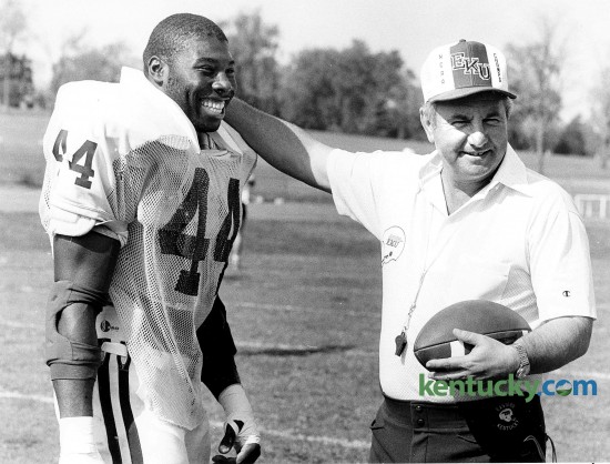 Eastern Kentucky University coach Roy Kid, right, with linebacker Fred Harvey on Oct. 10, 1984. Harvey was a four-year starter  for the Colonels and was named a first-team All-American his senior season. EKU’s all-time leading tackler with 503 tackles, Harvey was a two-time OVC defensive player of the year in 1984 and 1986. Eastern travels to play Florida on Friday in the swamp. Photo by Frank Anderson | staff