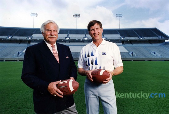 University of Louisville football coach Howard Schnellenberger, left, and University of Kentucky football coach Bill Curry June 25, 1993 after a press conference announcing the two schools had finally agreed to play each other, in this case in a six-game series starting in 1994. After a seven-decade absence, the two schools played Sept. 3, 1994, in Commonwealth Stadium. Kentucky won, 20-14. Talks between UK and U of L broke down in 1991 when Kentucky insisted that because of its eight- game Southeastern Conference schedule, plus a longstanding, home-and-home agreement with Indiana, it could not financially enter into another home-and- home series, especially with a school whose stadium seated only 38,000. But Louisville's drive to build a new 50,000-seat facility altered UK's thinking and a deal was struck in 1993. At the press conferecne announcing the deal to play each other, Schnellenberger and U of L Athletic Director Bill Olsen said that it was "50-50" U of L's new stadium would be completed by 1995. Turns out Papa John's Cardinal Stadium would not open until 1998. Photo by Charles Bertram | staff