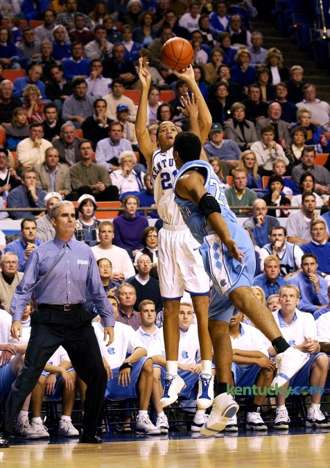 Tayshaun Prince shoots one his five made 3-pointers to open the Dec. 9, 2001 game against North Carolina in Rupp Arena. The senior electrified the home crows with his five consecutative treys in the the first three minutes and 46 seconds of the game. Prince went on to make his first seven shots, six from three-point range, and eight of his first nine (seven of eight from three-point range). He finished with a career-high-tying 31 points in Kentucky's 79-59 win. "He hit some ridiculous shots," said Tar Heels Coach Matt Doherty, shown next to Prince on the UNC bench. Photo by Helena Hau | Staff