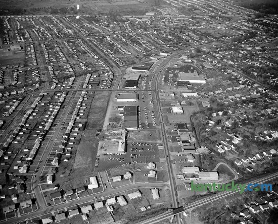 Aerial photo of Southland Shopping Center in Lexington, Jan. 1961. Running up the middle of the picture is Southland Drive and from left to right across the top is Harrordsburg Road. The farm land across the top would later be the site of Turfland Mall.