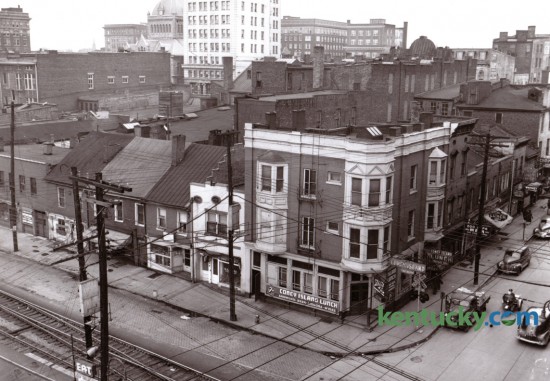 This 1947 view of what is now the CentrePointe block was used to illustrate several buildings that were going to be demolished to make way for a new Woolworth store. Five buildings in this block, including four of the six shown here facing what was then Water St, foreground, were torn down to make room for Woolworth, which fronted on Main St. South Limestone is seen at the right side of this photo. Published in the Lexington Leader April 3, 1947. 