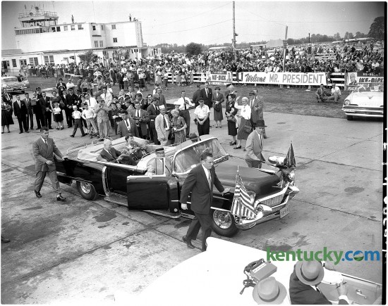 President Dwight Eisenhower (seated in rear of car with his wife Mamie) and his motorcade left Blue Grass Airport Oct. 1, 1956 after arriving to campaign for his re-election. After being meet at the airport by Kentucky Gov. Happy Chandler, the president's car rode through downtown in a parade. He later gave a speach at Memorial Colesium at the University of Kentucky.