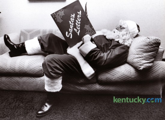 Santa read letters from children as he waited for the taping of the Santa Show on WKYT-TV on December 10, 1981. Photo by Frank Anderson | Staff