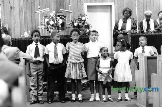 Children of the Bethel Baptist Church congregation sang during Sunday worship services June 22, 1986. Photo by John C. Wyatt | Staff
