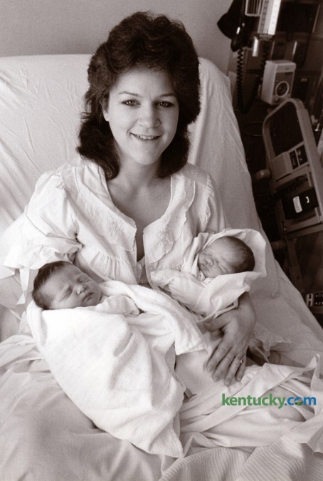 Cindy Clouse sat in her hospital bed at the UK Medical Center holding her twin daughters January 1, 1991. One daughter was likely the last child born in Lexington, at 11:47pm December 31, 1990 and the other one was the first born in the new year at 12:02am. The then unnamed babies weighed 7 lbs 8 oz and 7 lbs. 3 oz. respectively. They are the daughters of Roy and Cindy Clouse of Nicholasville. Photo by Tim Sharp | Staff