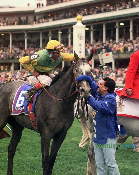 Jockey Gary Stevens is congratulated by groom Rudy Silva in the winners circle after Silver Charm won the 1997 Kentucky Derby. Photo by Charles Bertram