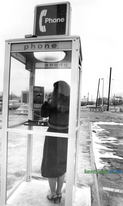 A woman uses a telephone booth March 1981 on Richmond Road in Lexington. Photo by Frank Anderson | staff