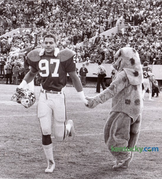 The Wildcat mascot greeted UK's Art Still as the 6-foot-7 defensive end took the field against Tennessee in his final college game November 30, 1977 at Commonwealth Stadium. Kentucky won 21-17. Still was the second overall player taken in the 1978 NFL Draft and played for the Kansas City Chiefs (1978–1987) where he was a 4-time Pro Bowl selection. Following the 1980-1982 and 1984 seasons, he named the Kansas City Chiefs's Most Valuable Player twice (1980 and 1984). He finished his pro career with the Buffalo Bills (1988–1989). Photo by David Perry | Staff