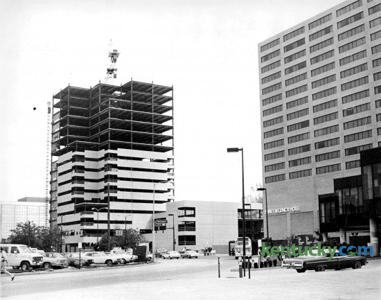 Construction of Kincaid Towers in downtown Lexington June 1978. The 22-story building was was finished in 1979 at a cost of $20 million. For eight years it was the talest building in Lexington. At right is the Hyatt Regency Hotel. Note at left is a parking lot that would later become Triangle Park. The fountain would run along the row of cars parked in this picture. Phot by E. Martin Jessee | staff
