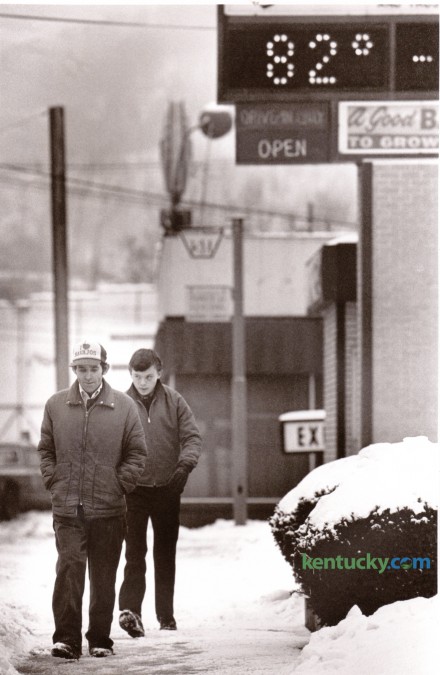 A bank's time and temperature display appeared overly optimistic as pedestrians walked along a snow-covered sidewalk on East Main Street Hazard January 28, 1987. Photo by Jim Wakeham | Staff