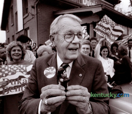 Senator Wendell Ford took a tiny Mike Dukakis doll wearing boxing  gloves from his pocket and showed it to those assembled before the  official opening of the Dukakis/Bentsen Fayette County Headquarters  on Winchester Road on October 17, 1988. Photo by Ron Garrison | Staff