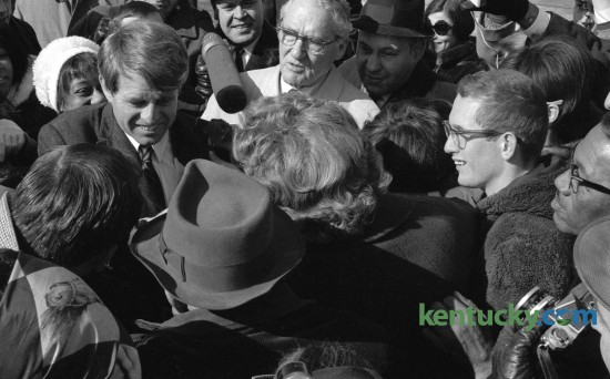 Sen. Robert F. Kennedy, left, shook hands with supporters after arriving at Blue Grass Field February 13, 1968, before beginning a two-day tour of poverty areas in Eastern Kentucky. Kentucky's U.S. senator John Sherman Cooper, center, met Kennedy at the airport. Published in the Lexington Leader February 13, 1968. 