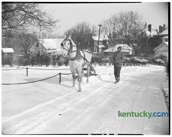 John Harris and Dan, his 10-year-old horse, used a snow plow to clear a drive at Transylvania College in February of 1947. Published in the Lexington Leader February 4, 1947. Herald-Leader Photo Archive