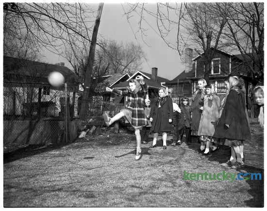 Girls playing kickball at Maxwell Street school, 474 East Maxwell Street. Published in the Herald-Leader February 13, 1949.