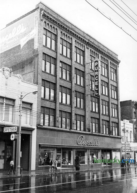 Purcell's department store in downtown Lexington at 320 W. Main St., Nov. 5, 1967. Purcell's, which opened in 1887 as a 5 &10 called the Racket Store, originally was located on the north side of West Main Street. In 1923, its founder, Jefferson Davis Purcell, bought property on the south side and opened a department store at 320 W. Main St. It was later enlarged. In its heyday, during the 1940s and '50s, Purcell's was not only one of Lexington's busiest, but one of its most colorful department stores. Customers often bypassed the crowded elevator so they would not miss anything on display in the store's 22 departments. It was one of the first in the city to have a live Santa Claus and strolling carolers at Christmas. At one time, the store carried 75,000 charge accounts, said Stanhope Wiedemann, president and CEO of the department store his grandfather founded. Among the many promotions it sponsored were embroidery and meat-carving schools and a table-setting contest. In 1951, at the request of a Lexington man, employees boxed the man up in a crate and delivered him, engagement ring in hand, to his girlfriend's home. She accepted. In 1970, after several stores left downtown, Purcell's closed. The building was razed in 1980 to make way for the $50 million Vine Plaza, which includes the Radisson Hotel and parking garage. Herald-Leader staff photo
