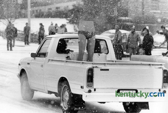 A driver goes down Limestone Street in Lexington with the bottom half of a mannequin wearing only underwear in the bed of his pick-up truck, February, 1979. Photo by Ron Garrison | staff