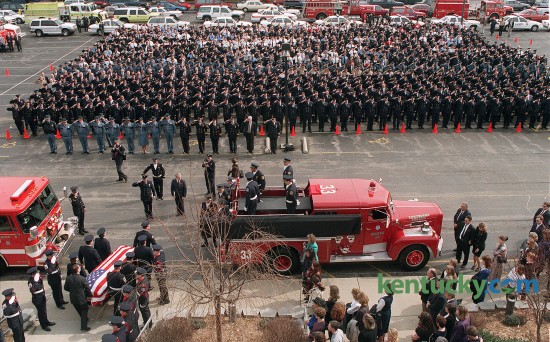DATE: Thursday,  February  20, 1997   id 2154266   CAPTION: The casket with the body of Charles "Chuck " Williams, II is carried from the Southland Christian Church after funeral services. Williams, died while fighting a house fire on Feb. 17. In background are firefighters from Lexington, surrounding counties and from across the state of Kentucky .  