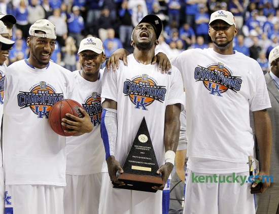 Kentucky's Patrick Patterson, let out celebration yell while holding the trophy with Ramon Harris, left, John Wall, and DeMarcus Cousins, right, after UK defeated Mississippi State, 75-74 in overtime March 14, 2010 in the SEC Tournament finals in Nashville. Kentucky trailed the Bulldogs by five with less than 90 seconds left in the second half but the contest was sent into overtime after a deliberately missed foul shot led to the game-tying bucket by Cousins just  before the final horn. Wall then scored eight of UK's 11 points in the extra period to give UK its 26th SEC Tournament title. Photo by Mark Cornelison | Staff